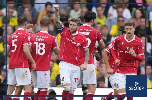 SBOTOP: Windass Brace Inspires Wrexham’s 3-2 Triumph Over Norwich as Parkinson Relieves Pressure